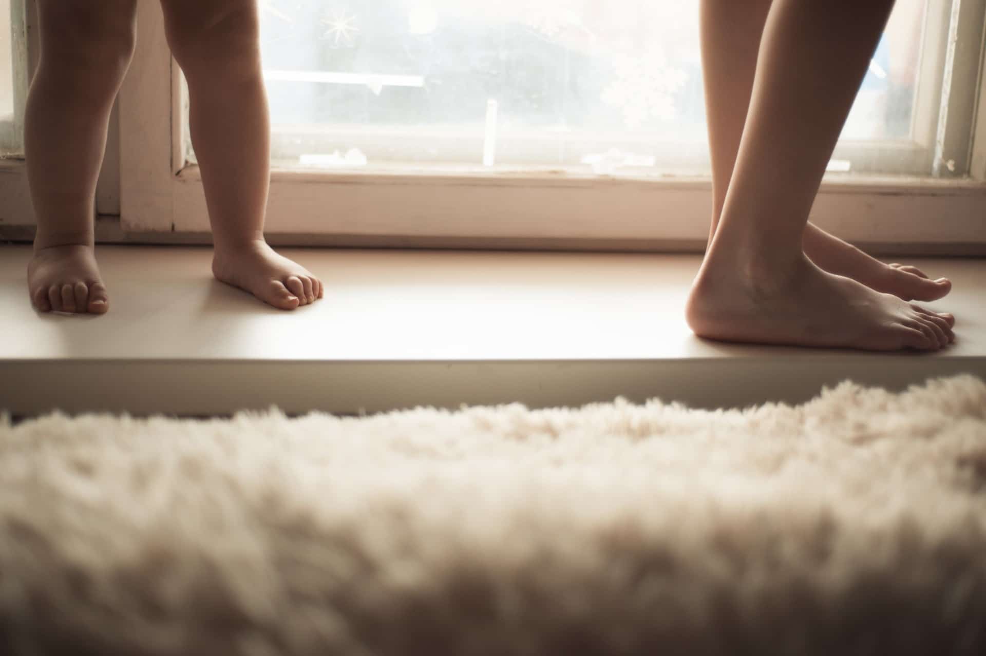 child and parent's feet