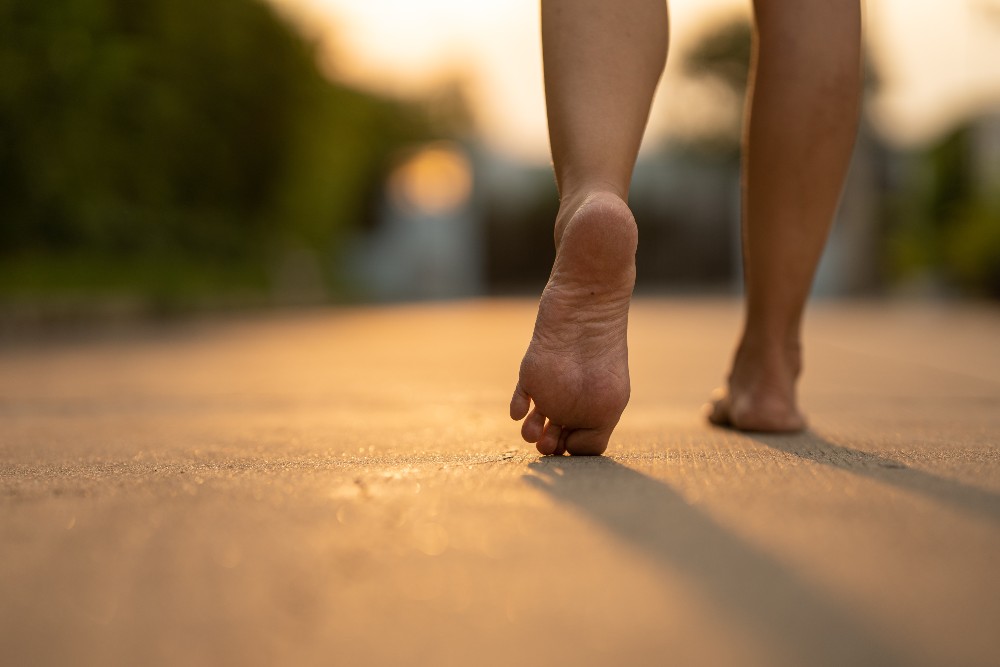 Person walking barefoot could lead to heel pain